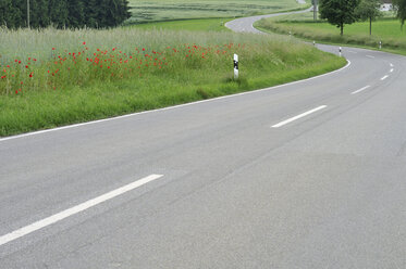 Germany, Baden Württemberg, Poppy field near road - SMF00404