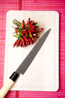 Chili pepper on chopping board, elevated view - MAEF01197