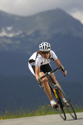 Germany, Bavaria, Mittenwald, Woman mountain biking - MRF01112