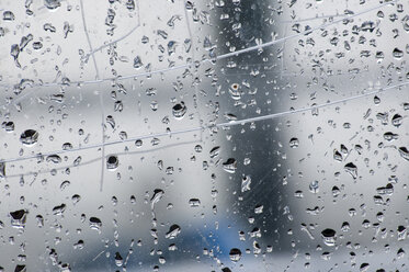 Raindrops on window pane, full frame, close-up - AWDF00183