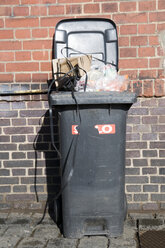 Garbage Can in front of brick wall - AWDF00147