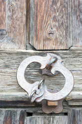 Switzerland, Arosa, Padlock on wooden door, close up - AWDF00101