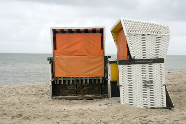 Germany, Amrum, North Sea, Beach chairs on beach - AWDF00095