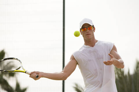 Man playing tennis stock photo