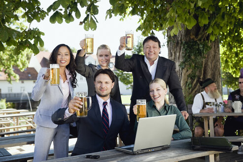 Germany, Bavaria, Upper Bavaria, Young business people in beer garden, portrait - WESTF09713