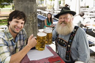 Germany, Bavaria, Upper Bavaria, People in beer garden - WESTF09606