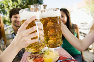 Germany, Bavaria, Upper Bavaria, Young people in beer garden, close-up - WESTF09599