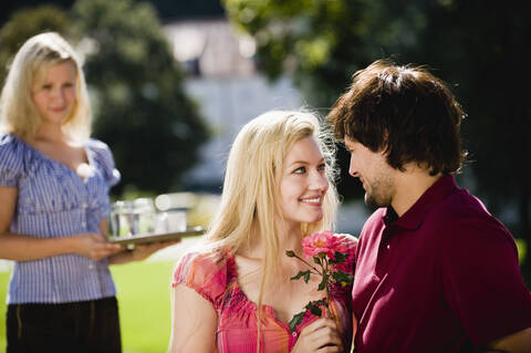 Germany, Bavaria, Upper Bavaria, Young couple in beer garden, portrait stock photo