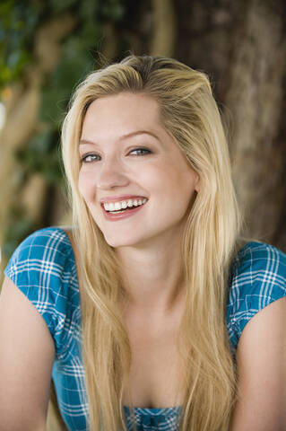 Germany, Bavaria, Upper Bavaria, Young woman smiling, portrait, close-up stock photo