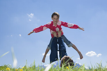 Father and daughter (6-7) playing in meadow - CLF00576