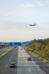 Airplane over freeway - MUF00671