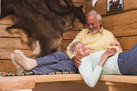 Senior couple in hunting lodge stock photo