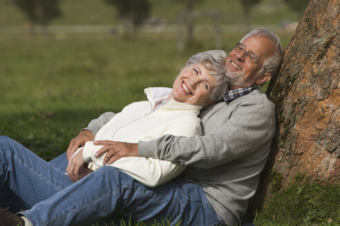 Austria, Karwendel, Senior couple in the countryside, embracing - WESTF10409