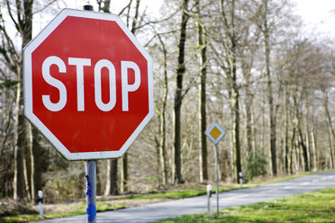 Stop sign on road, close-up - KSWF00222