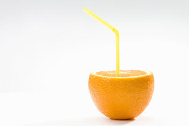 An Orange With a yellow Straw, close-up - MAEF01310