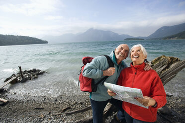 Germany, Bavaria, Walchensee, Senior couple looking up - WESTF10196