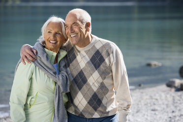 Germany, Bavaria, Walchensee, Senior couple embracing, smiling - WESTF10115