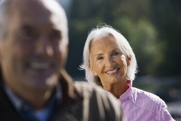 Germany, Bavaria, Walchensee, Senior couple smiling, portrait - WESTF10112