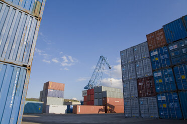 Stacked containers , crane in background - WDF00363