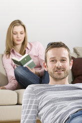 Young couple relaxing at home - CLF00647