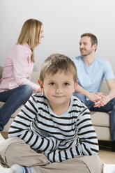 Parents talking, boy 4-5) sitting in foreground - CLF00636