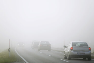 Traffic on road in mist - WW00377