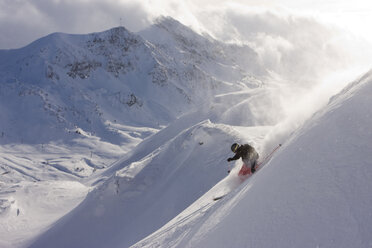 Austria, Obertauern, Person skiing on steep slope - FFF01048