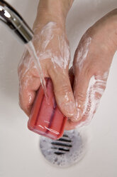 Woman washing hands, close-up - WDF00437