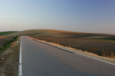 Spain, Andalucia, Highway at sunset - RUEF00157
