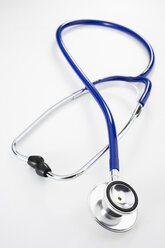 Stethoscope on white background, elevated view - JRF00097