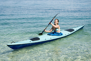 Greece, Ithaca, Woman kayaking - MUF00778