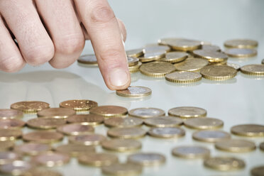 Person counting Euro coins, close up - CLF00692