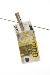 200 Euro bank note hanging on clothesline - 10675CS-U