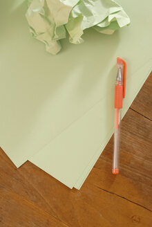 Letter paper, paper ball and pen, elevated view - KJF00036