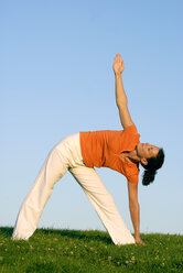 Woman practicing yoga, eyes closed - KJF00041
