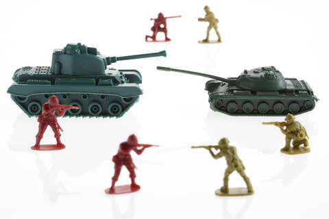 Spielzeug-Armee-Soldat und Spielzeug-Armee-Panzer, lizenzfreies Stockfoto