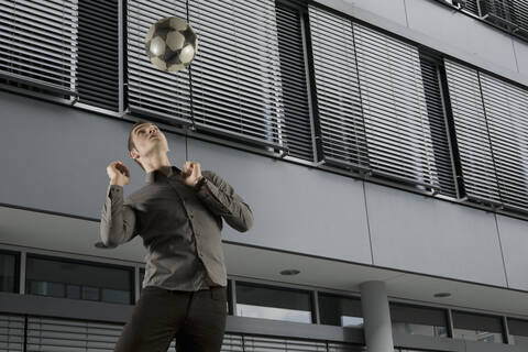 Man heading ball stock photo