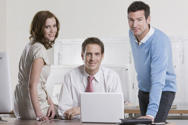 Germany, Munich, co-workers together in office, smiling, portrait - LDF00680