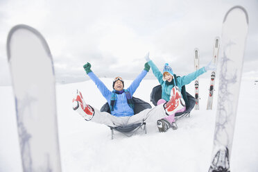 Italy, South Tyrol, Seiseralm, Couple relaxing in snow - WEST11661