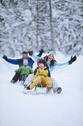 Germany, Bavaria, Family sledding, having fun - MAEF01765