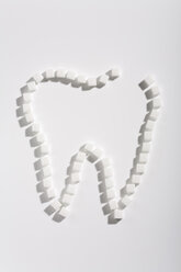 Sugar cubes forming a teeth, elevated view - WDF00494