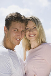 Germany, Bavaria, Munich, Young couple head to head, smiling, portrait, close-up - CLF00709