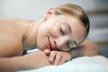 Germany, Bavaria, Munich, Young woman in spa, eyes closed, portrait - WESTF11935