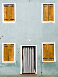 Italy, Venice, Burano, House facade, closed shutters, Front door with curtain - PSF00313