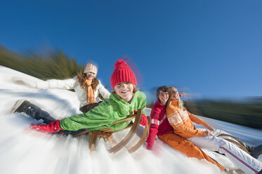 Austria, Salzburger Land, Altenmarkt, Family sledding - HHF02997