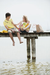 Germany, Bavaria, Ammersee,Young couple on jetty, portrait - WESTF12209