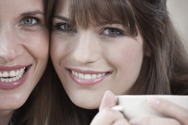 Germany, Cologne, Two women smiling, portrait, close-up - WESTF12467