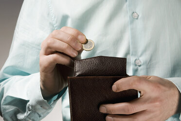 Person holding a wallet, close-up - RBF00137