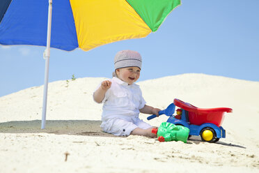 Germany, baby boy (9 months) playing on beach - MAEF01815