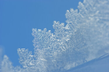 Austria, Salzburger Land, Snow crystal against blue sky - HHF03034